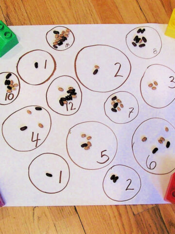 Paper with numbered circles and beans for preschool counting activity