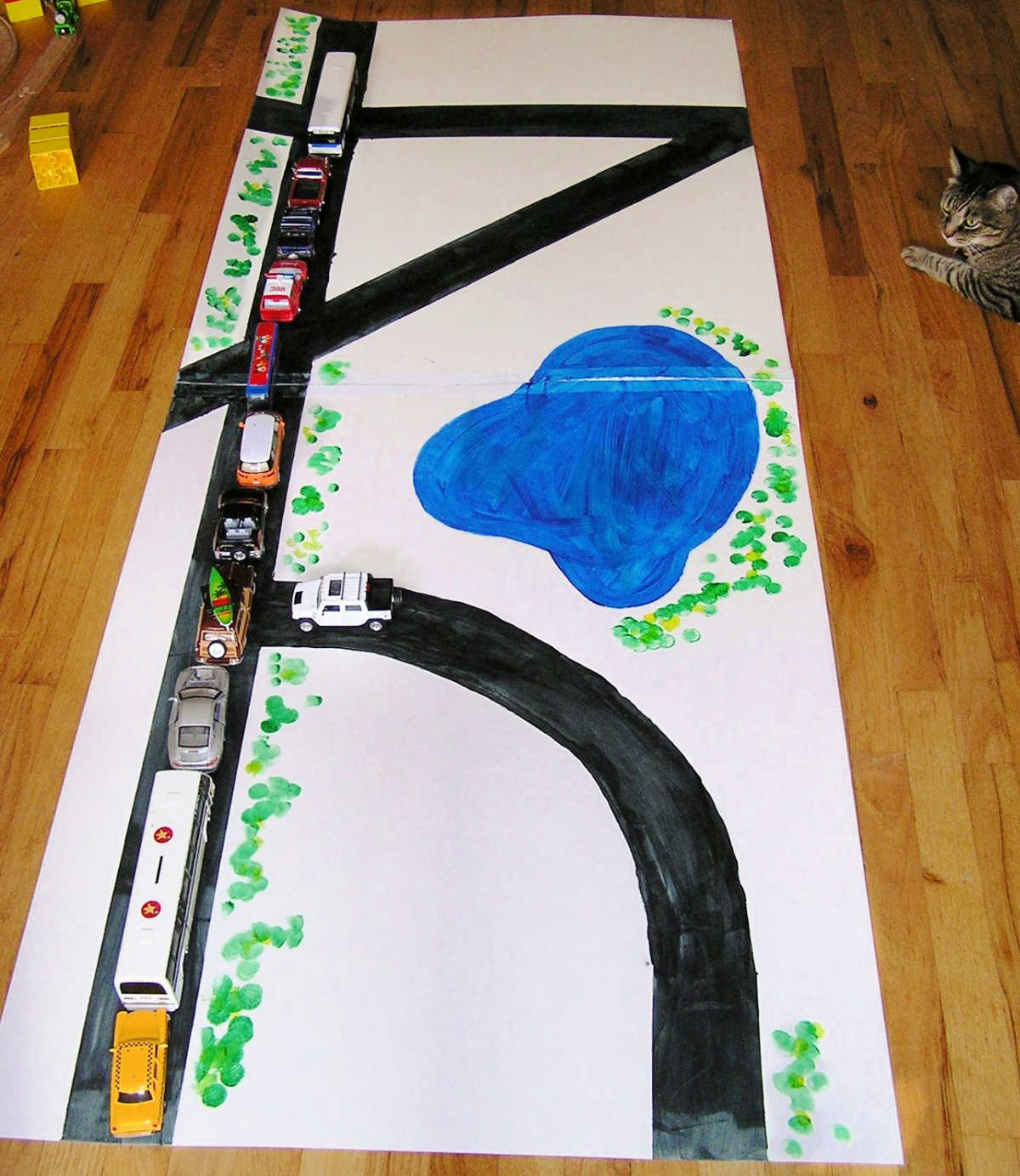 Diy road for toy cars made from large matte board
