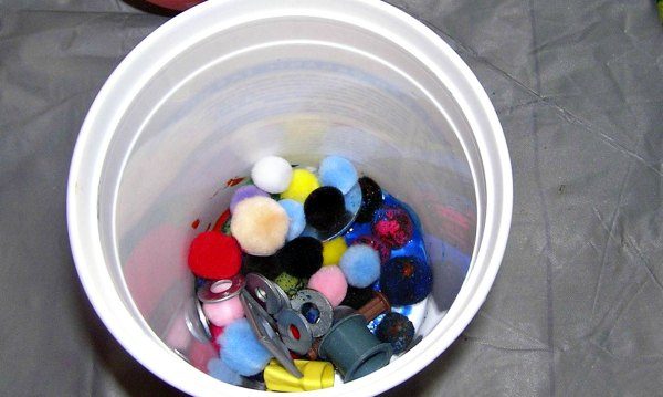 Filled container for shaken preschool art project