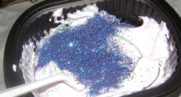Glitter in bowl of puffy paint