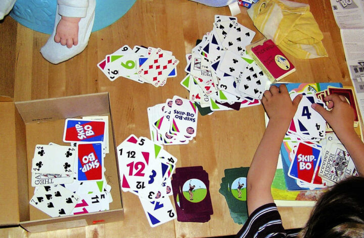 Child sorting playing cards
