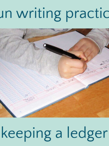 Child writing in accounting ledger.