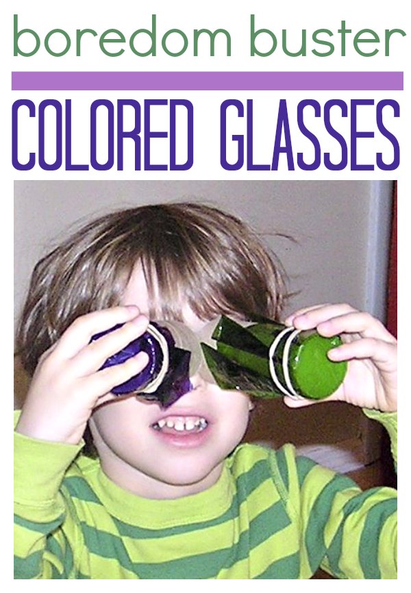 boy looking through diy colored tubes made with cellophane and cardboard