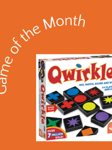 Quirkle board game in box on orange background with curved text, "Game of the Month"
