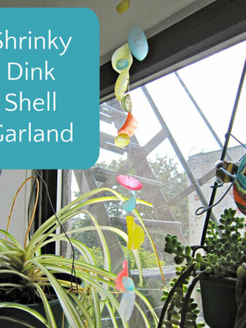 shrink plastic garland hanging in window