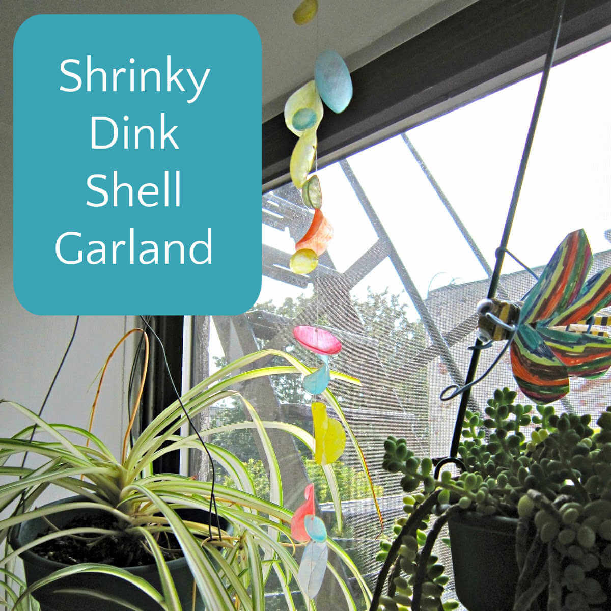 shrink plastic garland hanging in window
