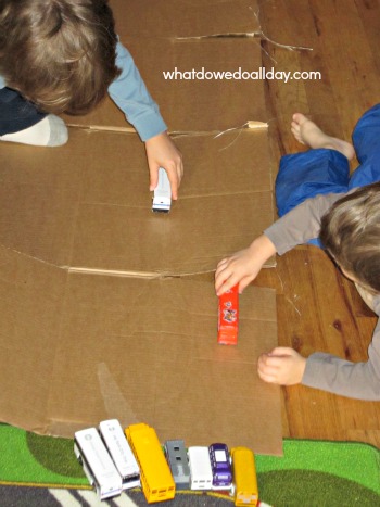 Use a cardboard box to make a toy car road