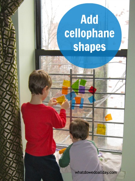Make faux stained glass art on the window with cellophane shapes