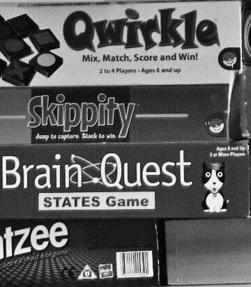 Stack of games in boxes.