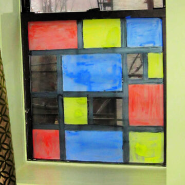 Window painted in style of Mondrian art.