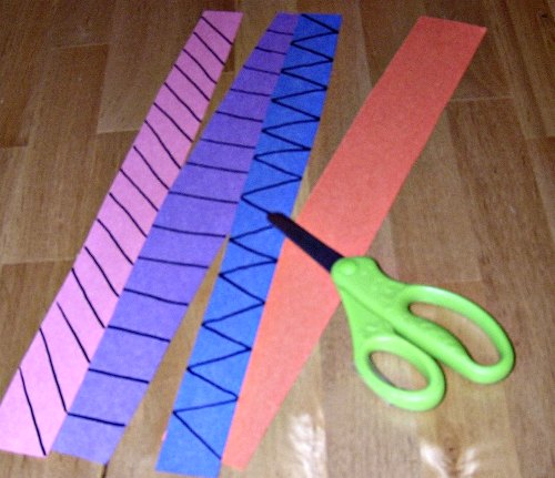 Fine motor activity for kids using scissors and paper strips