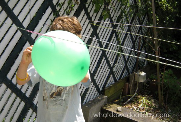 Balloon rocket experiment for kids. Summer science fun. 