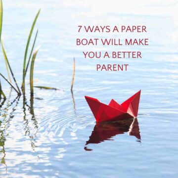 red paper boat on pond