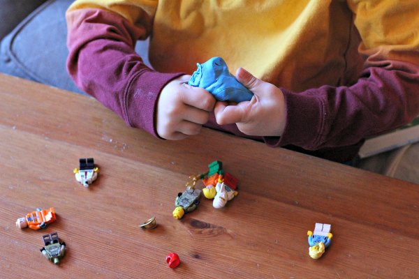Fine motor activity with LEGO and putty.