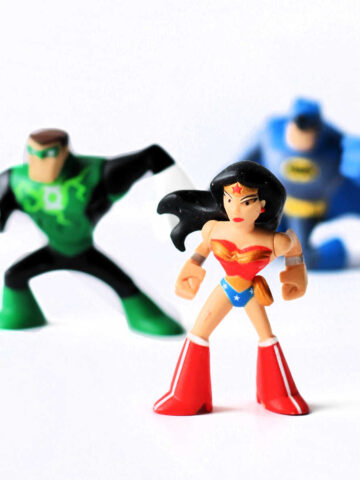 Wonder Woman figurine with Flash and Batman in background