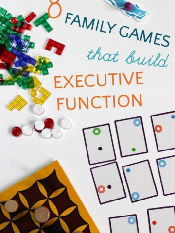 Scattered assortment of game boards, cards and game tokens.