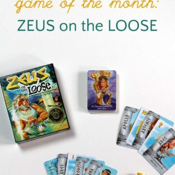 Zeus on the Loose game box, card and small yellow Zeus figurine.