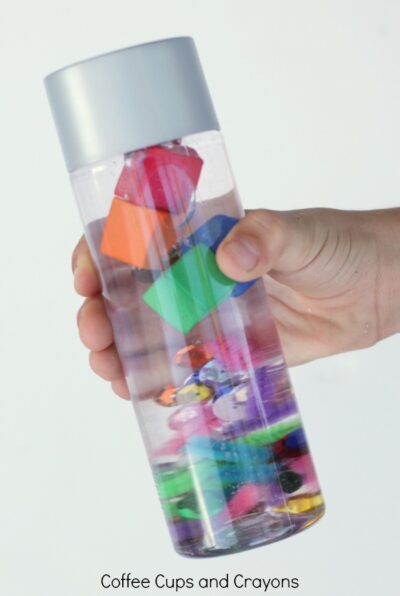 Fun science at home with a sink or float science discovery bottle for kids. 