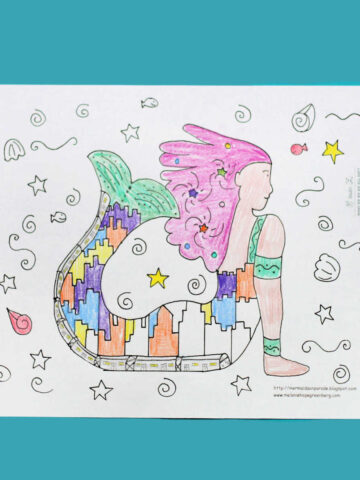 Mermaid coloring page with colored pencils.