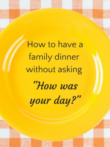 Yellow plate on orange checked tablecloth with text inside plate that reads "how to have a family dinner without asking how was your day?"