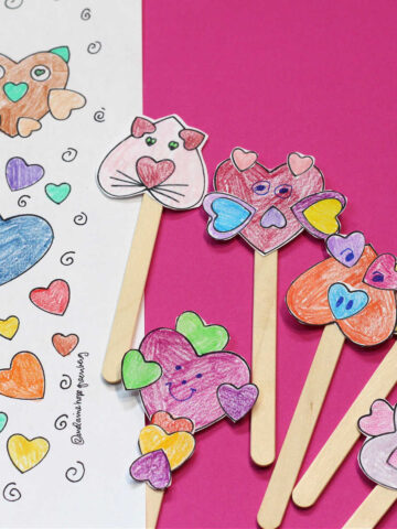 Paper Animal stick puppets made from heart shapes and craft sticks.