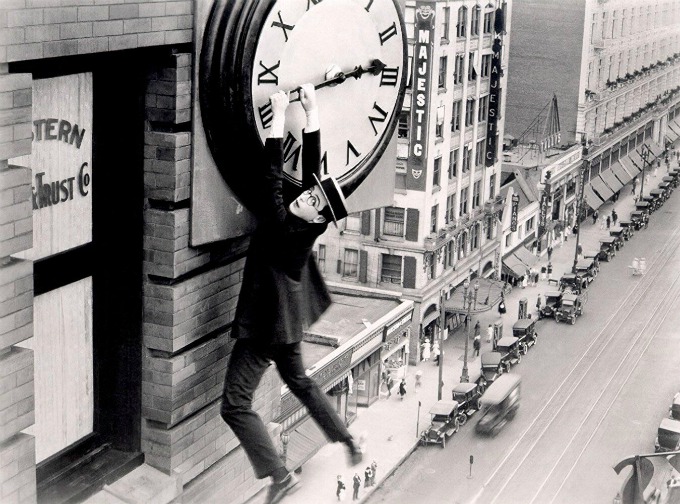 Harold Lloyd hanging off clock in safety last