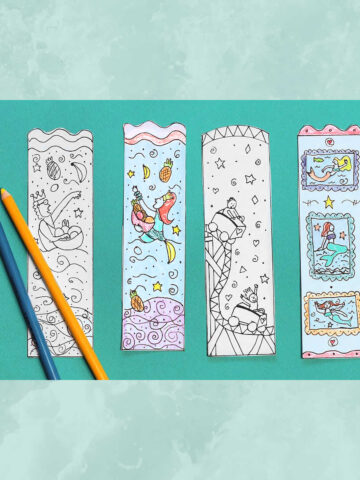 Four mermaid bookmarks and two colored pencils.