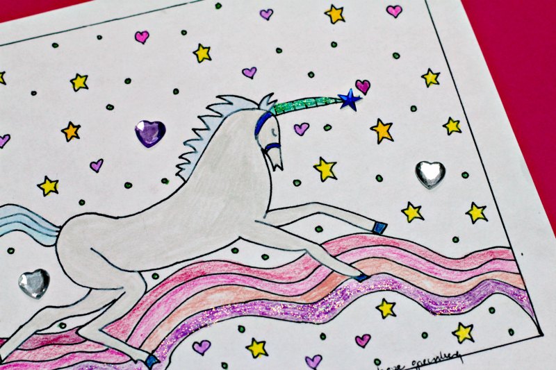 close up of unicorn and rainbow coloring page