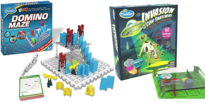 Domino maze game box and board with pieces next to Invasion of the Cow Snatchers logic game board and box.