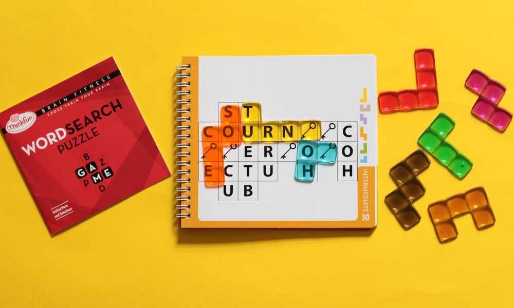 Word Search game booklet and colored translucent tiles.