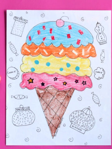 ice cream cone coloring page on pink background with crayons