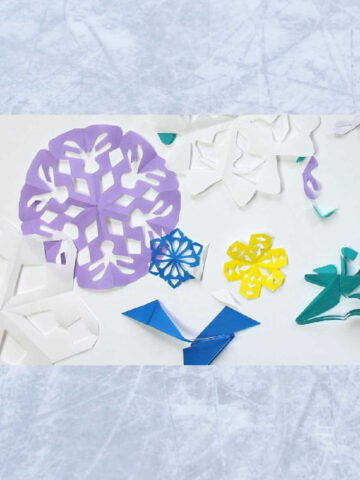 Paper snowflakes in different colors and sizes.