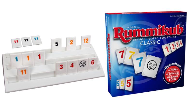 Rummikub game box and tiles on holder. 