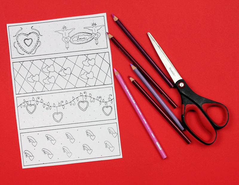 Coloring page showing four valentine bookmarks next to scissors and colored pencils