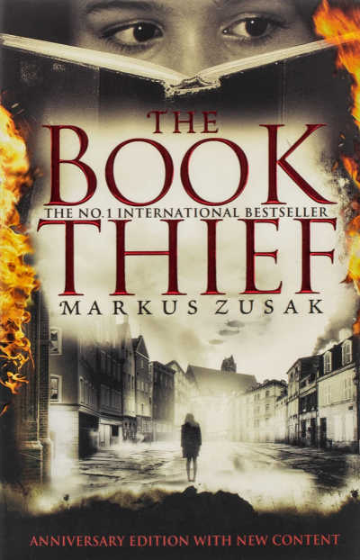 The Book Thief book cover showing face behind open book and city at war