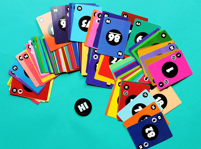 Fanned out colorful, numbered cards from game Hi Lo Flip.
