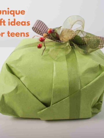 Gift wrapped in green paper and ribbon with text, unique gift ideas for teens.