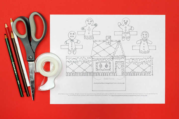 Plain gingerbread house coloring page with colored pencils, scissors and tape