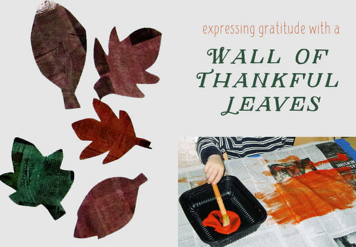 Thankful tree leaves and child painting on newspaper