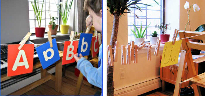 Child hanging letter cards on string with clothespin.