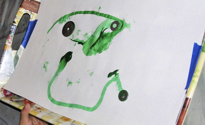 Green paint and hardware on paper for magnet painting project