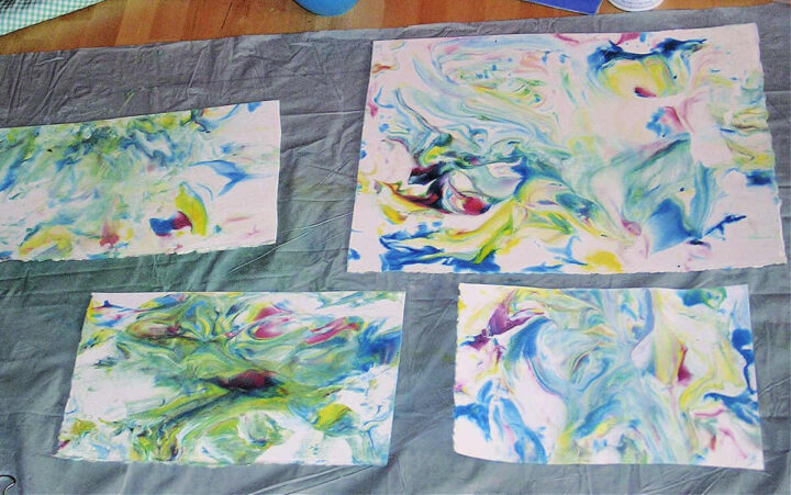 Four pieces of Marbled paper made with shaving cream