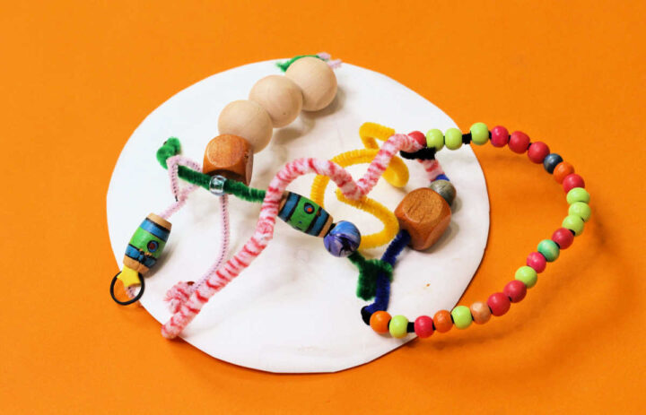 Lacing card from paper plate, pipe cleaners and beads