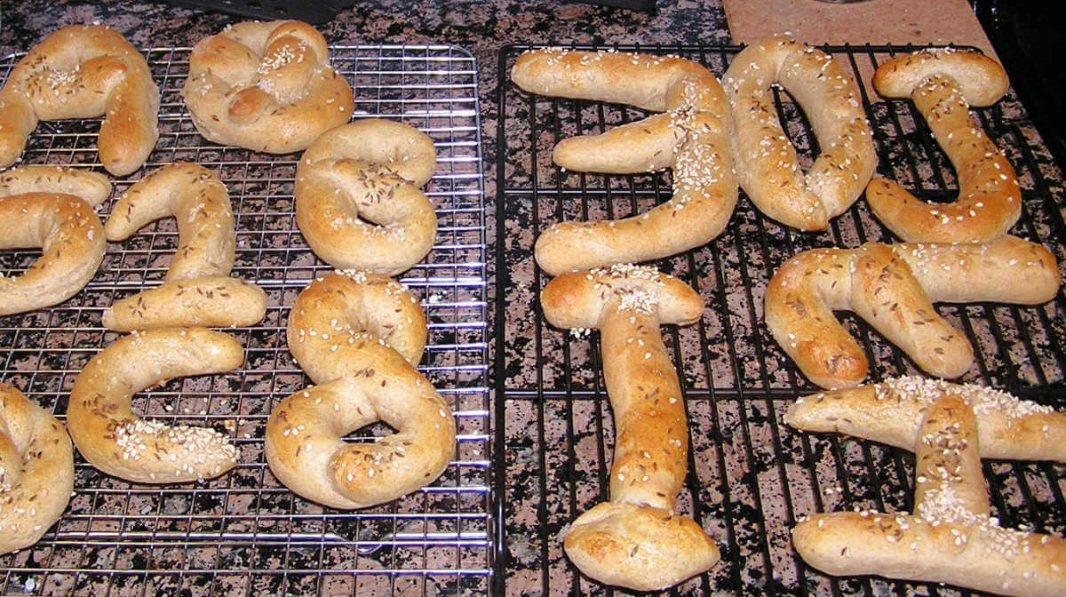 finished pretzel number and letter shapes on drying racks