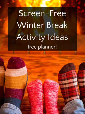 Three pairs of feet in socks in front of fireplace with text overlay, Screen-Free Winter Break Activity Ideas - free planner.