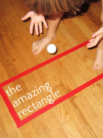 Child dropping ping pong ball onto floor inside of a red tape rectangle. Text overlay reads "the amazing rectangle."