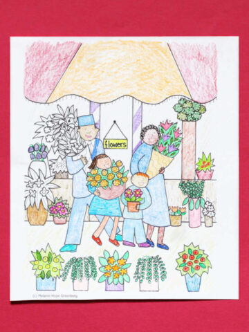 May flowers coloring page, colored in, with coloring pencils.