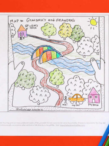 Road trip coloring page featuring road through trees and over bridge from one house to another with group of colored pencils lying next to coloring sheet.