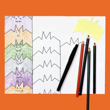Bat tessellation art in progress with one row of tessellations colored in with purple, orange, grey and green colored pencils.