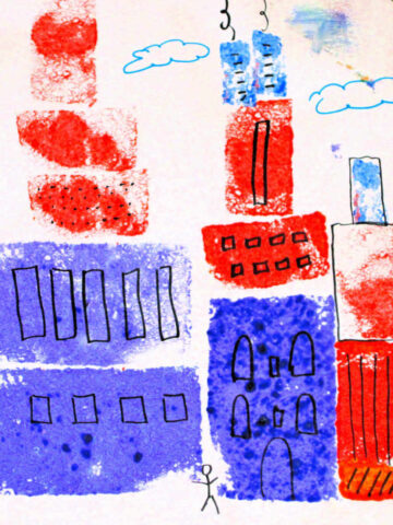 Children's art project of a skyline created by sponge painting shapes